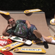 Jack Black reclines in his garden of skateboards.